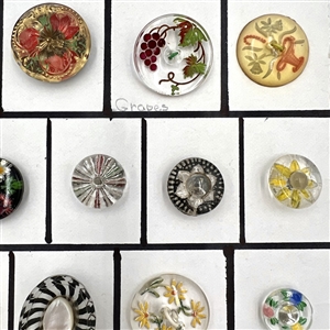 Twenty five assorted reverse carved and painted glass buttons.