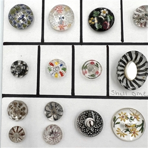Twenty five assorted reverse carved and painted glass buttons.