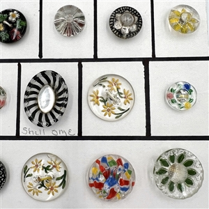 Twenty five assorted reverse carved and painted glass buttons.