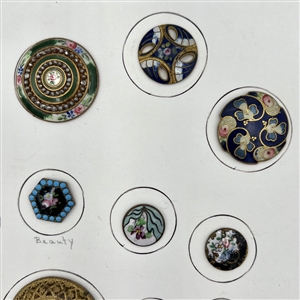 Card of twenty five enamel buttons.