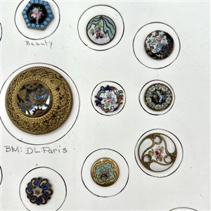 Card of twenty five enamel buttons.