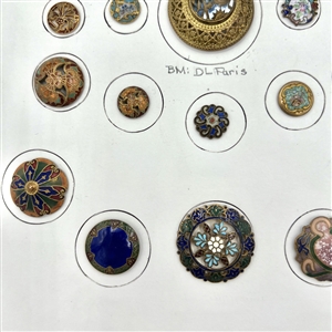Card of twenty five enamel buttons.
