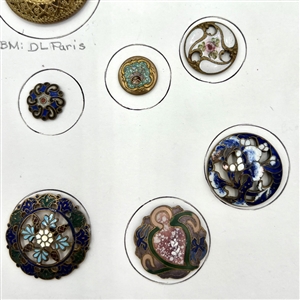 Card of twenty five enamel buttons.