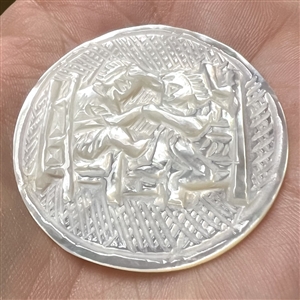 Bethlehem pearl “Pulling Hair” button.