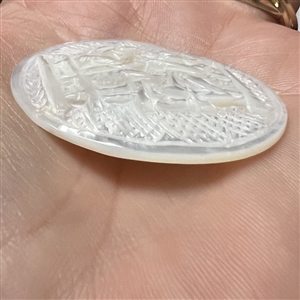Bethlehem pearl “Pulling Hair” button.