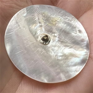 Bethlehem pearl “Pulling Hair” button.