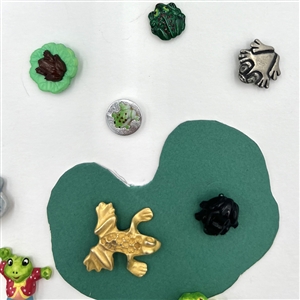 Card of twenty eight frog buttons.