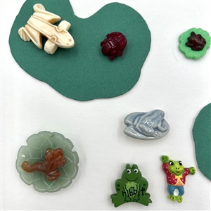 Card of twenty eight frog buttons.