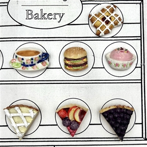Card of twenty one ceramic buttons of bakery items.