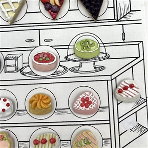 Card of twenty one ceramic buttons of bakery items.