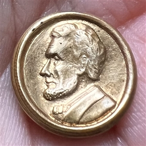 “Abraham Lincoln” commemorative button.