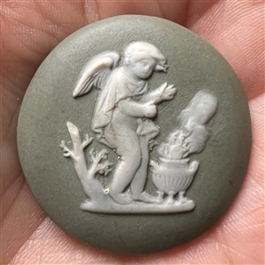 “Cherub by a brassier” Jasperware studio button by Marie La Barre Bennett.