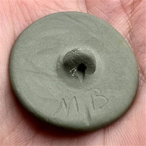 “Cherub by a brassier” Jasperware studio button by Marie La Barre Bennett.