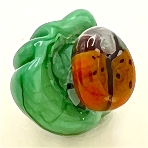 Mary Gaumond’s DIMINUTIVE lady bug studio glass button.