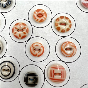 Card of forty two china stencil buttons.