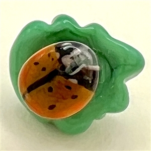 Mary Gaumond’s DIMINUTIVE lady bug studio glass button.