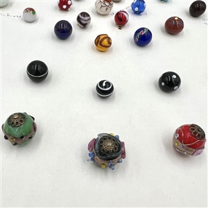 Card of forty one glass ball and modified ball buttons. 