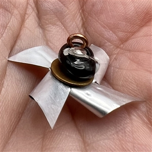 Mary Gaumond’s movable pinwheel studio button.