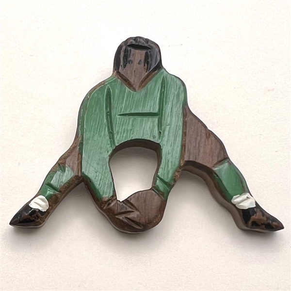 Wooden button of a soccer player.