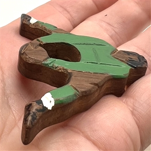 Wooden button of a soccer player.