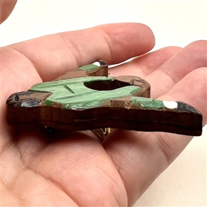 Wooden button of a soccer player.
