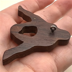 Wooden button of a soccer player.
