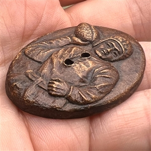 Burwood button of a football player.