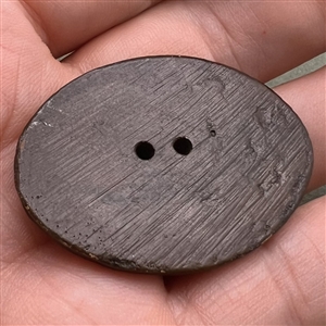 Burwood button of a football player.