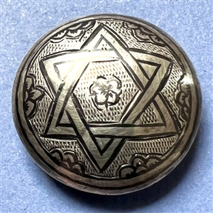 Niello silver button of interlocked star.