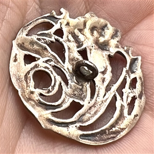 Hallmarked openwork silver button of a plant (thistle?).