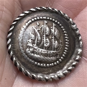 Continental silver button of a sailing ship.