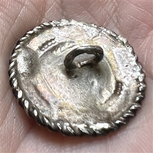 Continental silver button of a sailing ship.