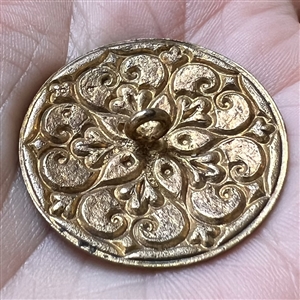 A champlevé enamel button.