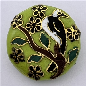 Chinese cloisonné button of a bird in a flowering tree.