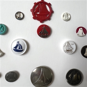 Card of twenty five sail boat buttons.