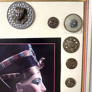 Card of twenty Egyptian buttons.