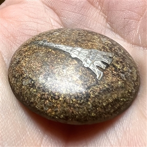 Flecked horn button with silver Eiffel Tower.
