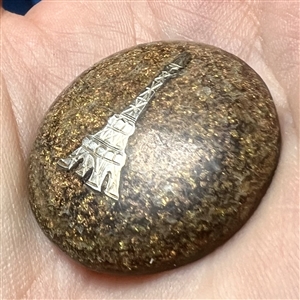 Flecked horn button with silver Eiffel Tower.