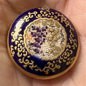 Satsuma button of Wisteria in an ornate cobalt border.