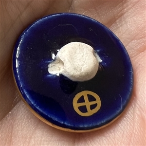 Satsuma button of Wisteria in an ornate cobalt border.