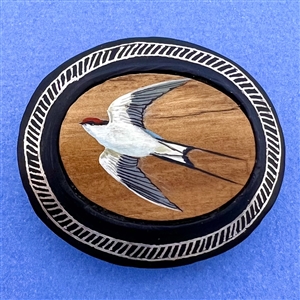 Large button of a swallow bird painted on sandalwood with metal Bidri border.