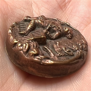 Brass button of hunter being chased by a boar.