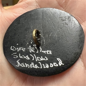 Large button of a swallow bird painted on sandalwood with metal Bidri border.