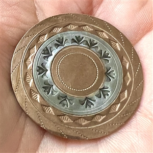 An 18th c. Silvered and heavily chased copper Colonial button.