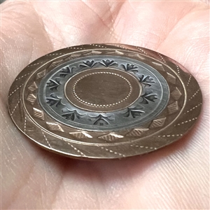 An 18th c. Silvered and heavily chased copper Colonial button.