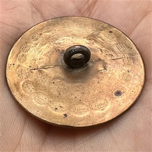 An 18th c. Silvered and heavily chased copper Colonial button.
