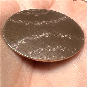 An unusual 18th c. Chased copper Colonial button of wavy pattern.