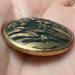Blue green glass button of a sea design
