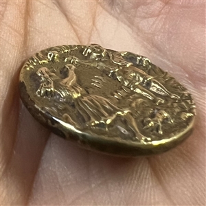 Brass button of boy and girl and playing catch with a ball.