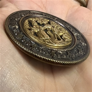 Heavily tinted “Red Riding Hood and the Wolf” brass with tinted border button,